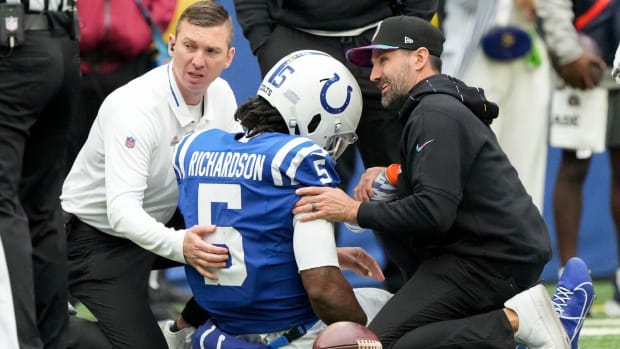 Colts quarterback Anthony Richardson sits on the ground after hurting his shoulder